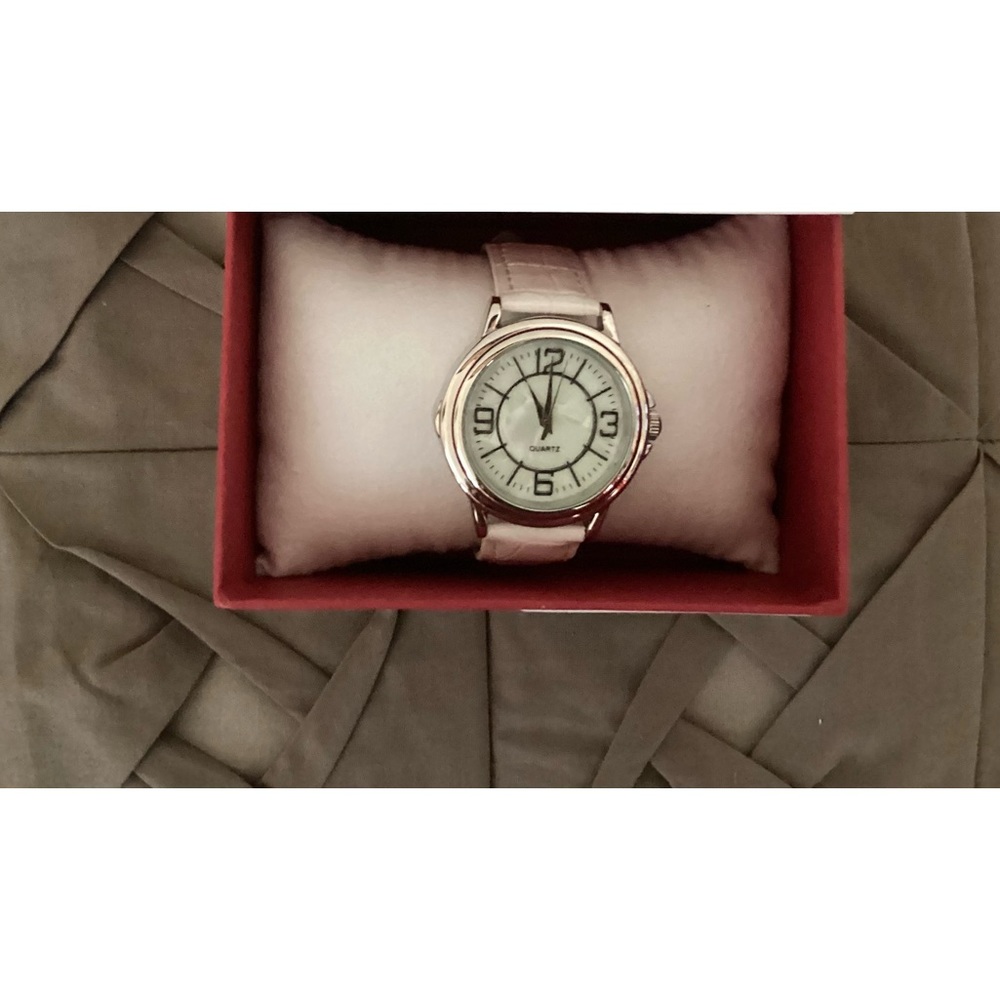 Avon ladies quartz watch; white patent leather straps, stainless steel back New